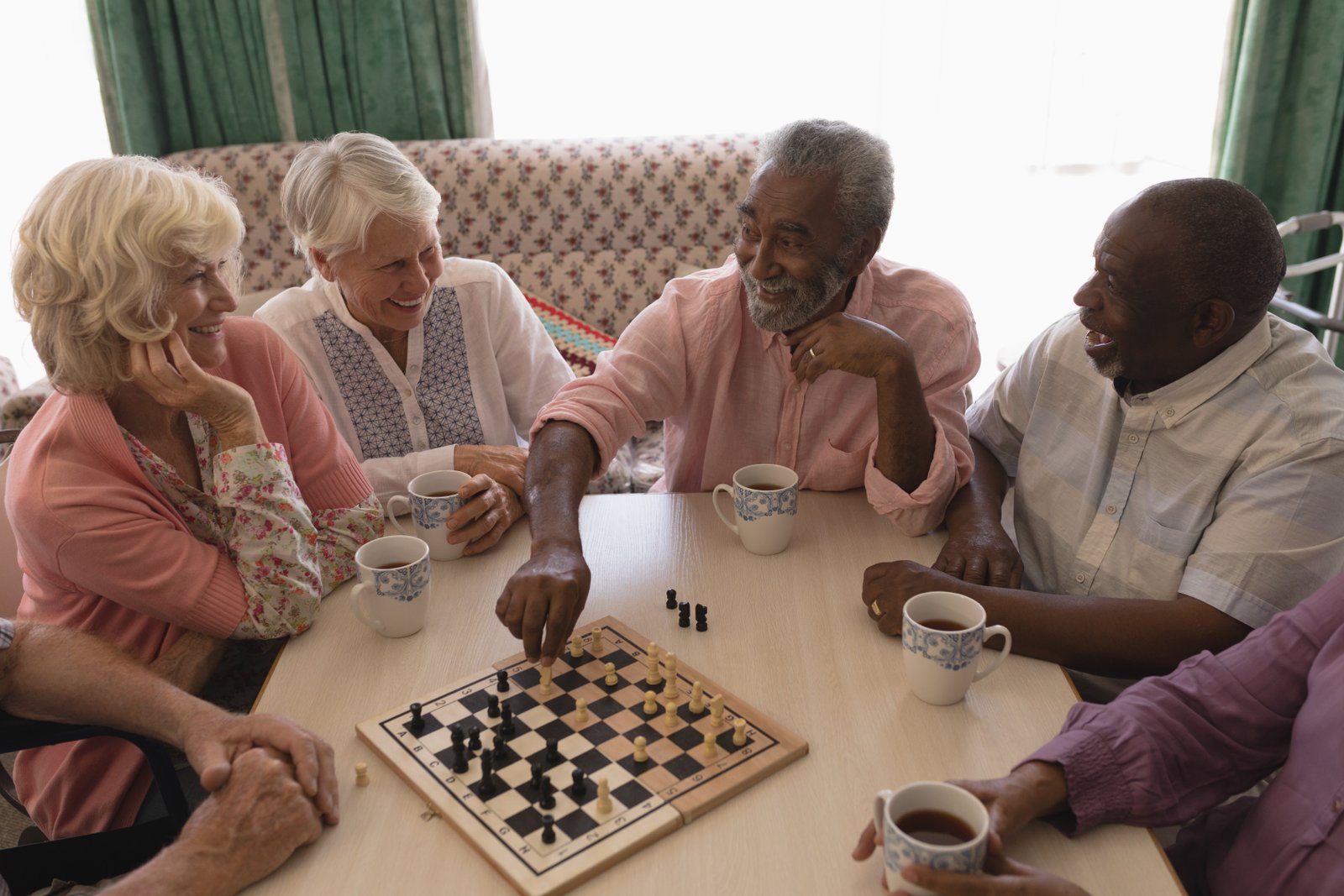 group-senior-people-playing-chess-living-room.jpg